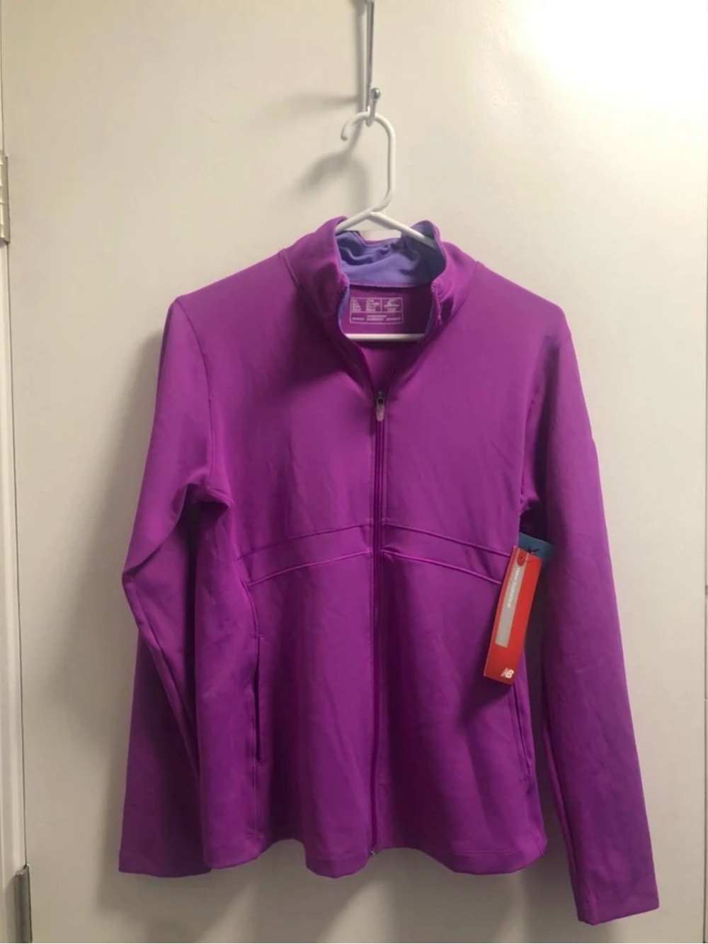 *New Balance Purple zip up jacket with UPS on the sleeve.
